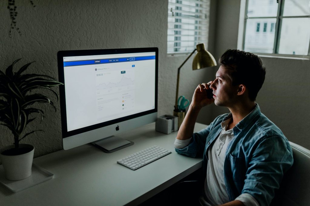 Man working at a computer at home